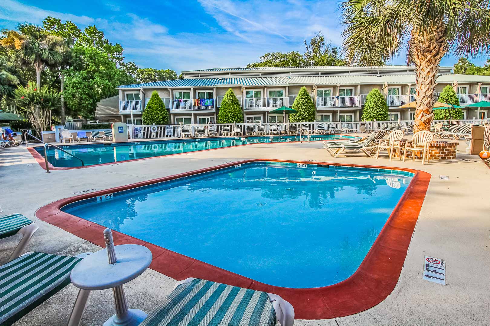 A peaceful outdoor swimming pool at VRI's Players Club Resort in Hilton Head Island, South Carolina.